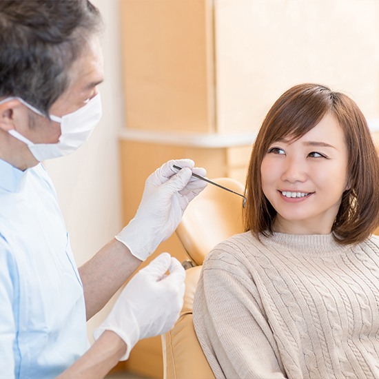 Dentist checking womans saliva