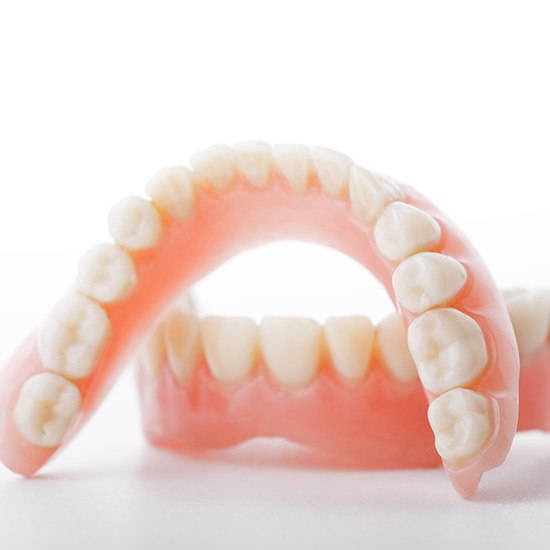 Full set of dentures on a white background