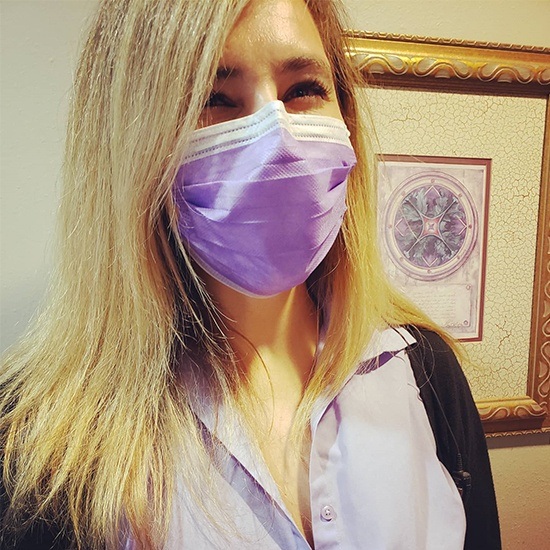 team member wearing purple mask