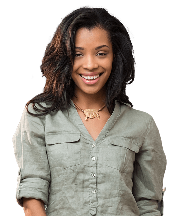 Woman in green shirt smiling after periodontal therapy