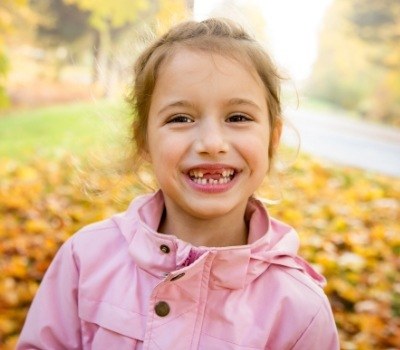 Girl missing front teeth in need of children's dentistry