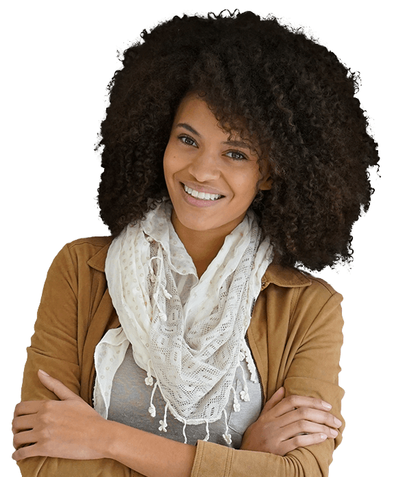 Woman wearing scarf smiling after porcelain veneer treatment