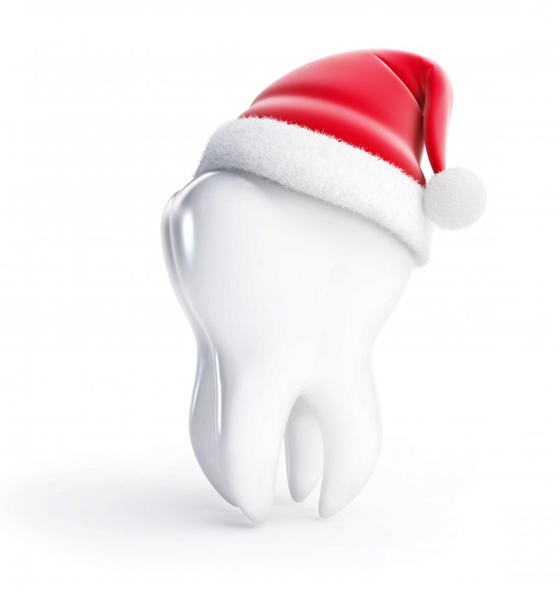 3D model of a tooth with a Santa cap on