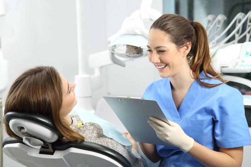 patient speaking to dentist about mental health effects on smiles