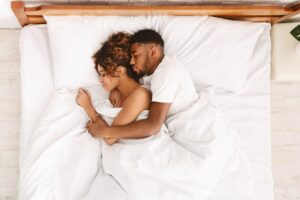 young couple spooning peacefully 