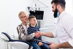 A mother and a child visiting a dentist
